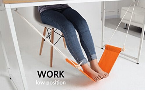 Put your foot up on the hammock under the desk comfortable work position