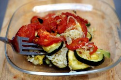 zucchini and tomatoes over rice