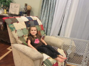 little girl on a couch