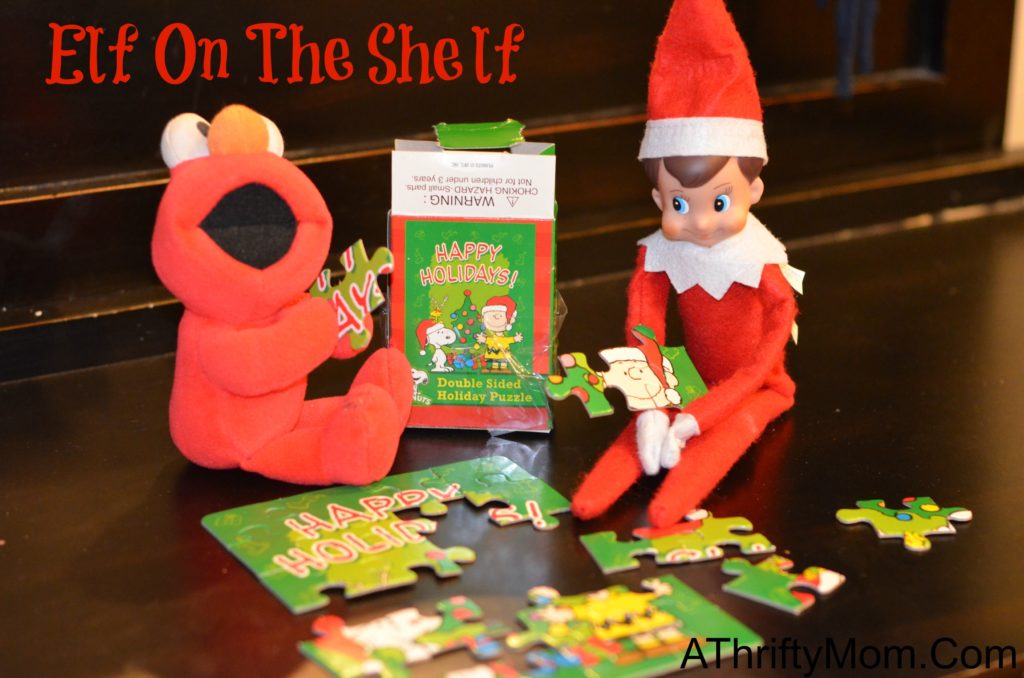 elf on the shelf ideas putting a puzzel together