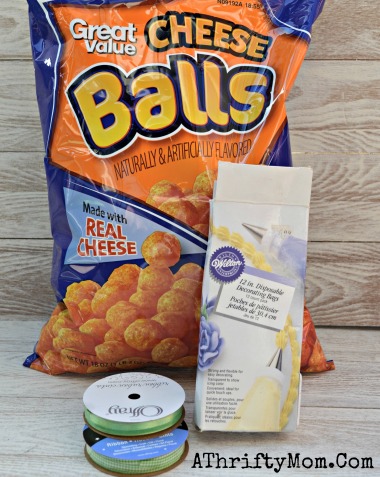 Easter Carrots, Cheeto or Cheese Puffs carrots for Easter. Easy snack ideas for kids, all you need is Cheese Puffs, Ribbon and a Frosting bag #Easter, #Kids, #Snacks, #Cheetos
