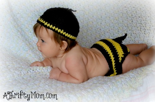 Babies dressed like bugs, playing dress up with out cute little babies .